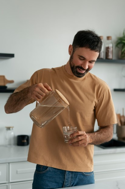 Man pouring clean water